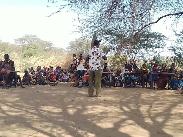 Civic forum held beneath the acacia trees